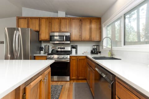 Fully equipped kitchen with all dishes, cookware, and bake ware