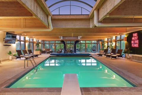 Dive into relaxation in this expansive indoor pool, where comfort meets luxury under the soothing embrace of natural light.