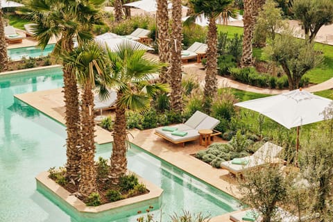 Indoor pool, 3 outdoor pools, open 10:00 AM to 6:00 PM, pool umbrellas