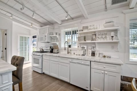 Kitchen with lots of dishes to use.
