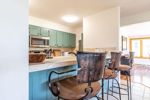 Breakfast bar with seating for three.