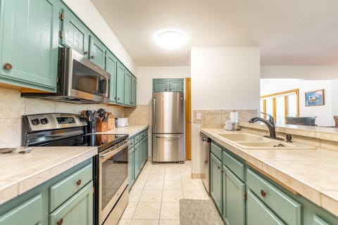 Updated full size kitchen with stainless steel appliances.