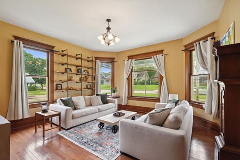Bright living space with two large sofas, smart TV