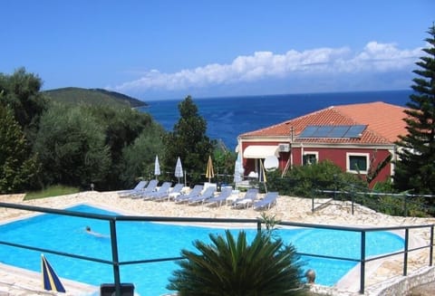 Seasonal outdoor pool, open 9:00 AM to 7:00 PM, pool umbrellas