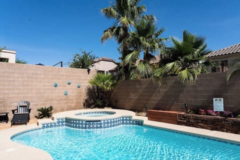 The private pool and hot tub in the back yard
