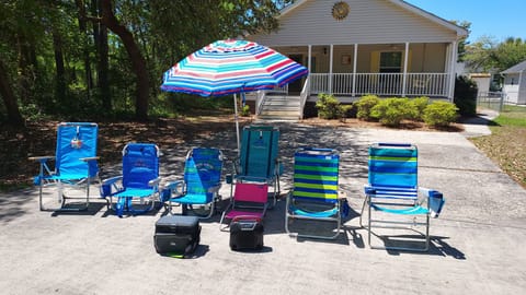 Plenty of gear for the beach!  Chairs, umbrella, cooler and portable speaker 