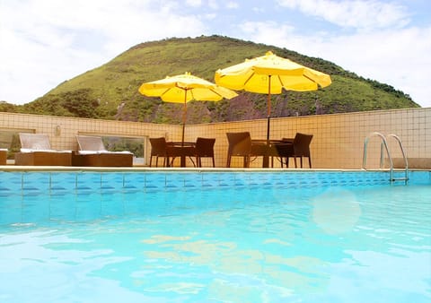 Outdoor pool, open 9:00 AM to 10:00 PM, pool umbrellas, sun loungers