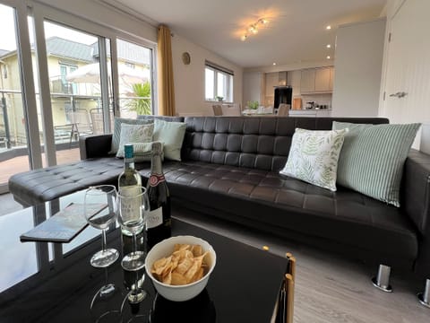 Relax in the comfortable and spacious living room at 4 Bayhouse, perfect for a cosy holiday in Shanklin, Isle of Wight.
