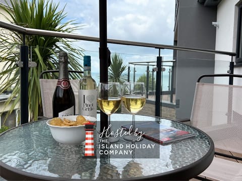 Relax on the balcony of 4 Bayhouse and enjoy stunning sea views during your holiday in Shanklin, Isle of Wight.