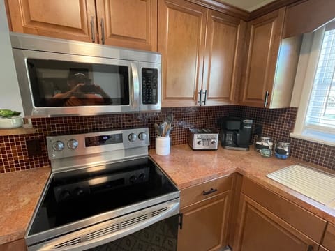 Brand new LG microwave and range top with convection oven / new Keurig machine.