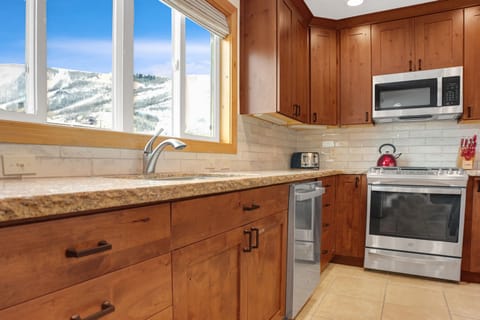 Park City Mountain views from the kitchen, granite countertops and hardwood cabinets