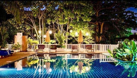 Outdoor pool, open 7:00 AM to 9:00 PM, pool umbrellas, sun loungers