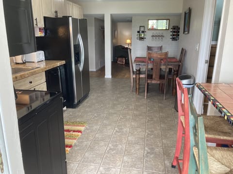 Looking from the sliding door, through the kitchen and towards the living room