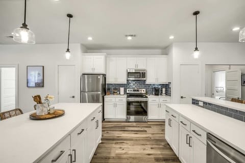 2 Islands w/ Bar Height Seating