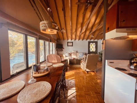 Large dining table with a view over the water.