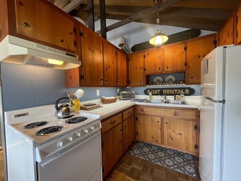 Cottage kitchen, stocked with the basic spices, coffee, tea and cookware.