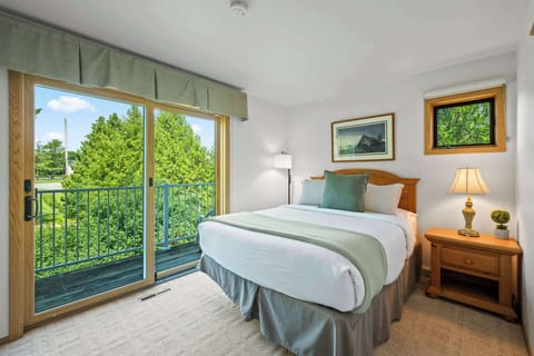 Bedroom #1 (second floor) includes a queen bed and a balcony