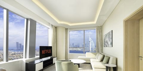 Deluxe Apartment | Living area | 55-inch Smart TV with cable channels, TV, Netflix