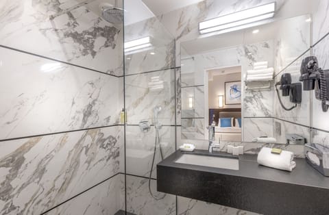 Triple Room | Bathroom | Shower, hair dryer, towels