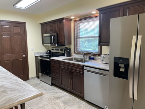 Family House, 3 Bedrooms | Private kitchen | Full-size fridge, microwave, coffee/tea maker, freezer