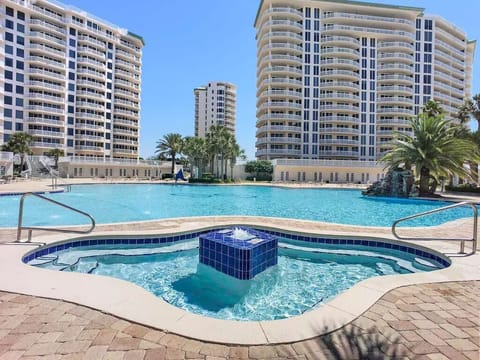 Large adult hot tub, speakers with music all around the lagoon pool.