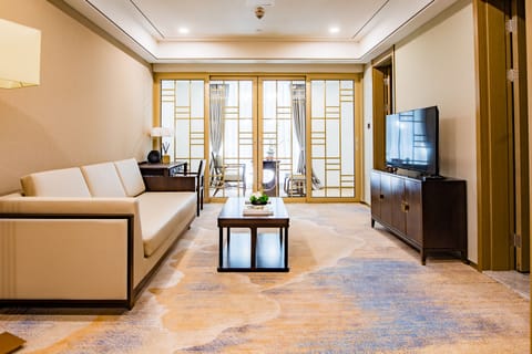 Junior Suite | Living area | 49-inch LCD TV with cable channels, TV