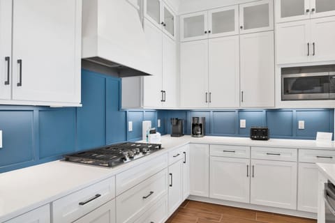 Featuring stone counters and stainless appliances