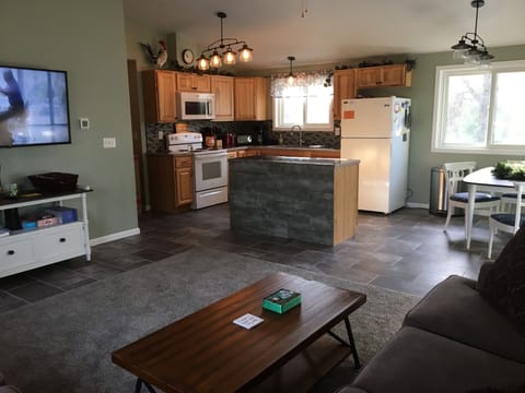 Kitchen is open and roomy with a useful island for food prep.
