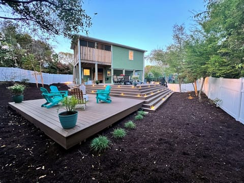 A fully fenced backyard with seamless access to the game room and screened porch