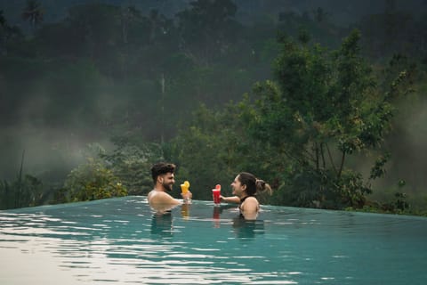 Outdoor pool, open 8:00 AM to 6:00 PM, pool umbrellas