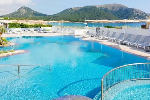 Outdoor pool, open 9:00 AM to 8:00 PM, pool umbrellas, sun loungers