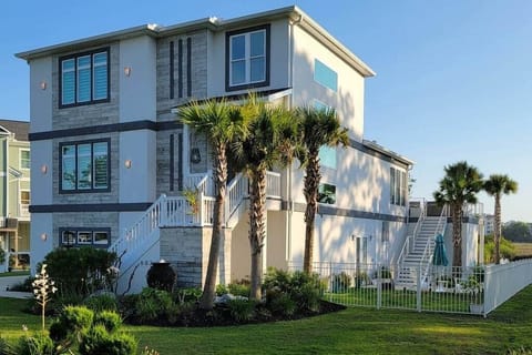 Beautiful 3-story home with elevator, pool, golf cart & very close to the beach! 
