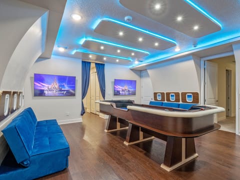 - Movie nights come alive in this Disney inspired theater room  
- Airplane themed seating and glowing LED lights create magic  
- Vacation rental near Orlando with private cinema experience