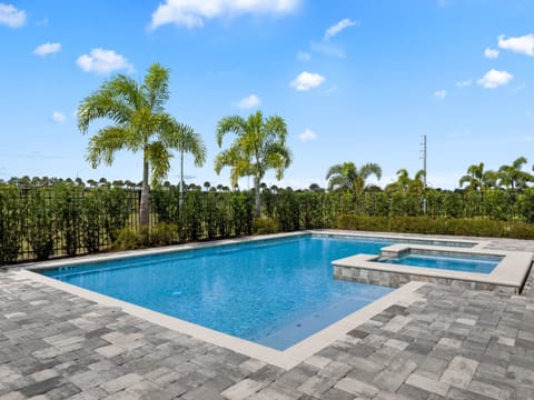 - Relax in your private pool with crystal clear water and spa seating
- Surrounded by palm trees for the ultimate Florida escape
- Vacation rental near Disney with outdoor pool amenities
