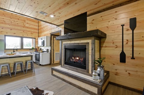 Gather around the living room fireplace for cozy nights in — it’s the heart of the cabin.