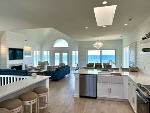The spacious, airy great room opens to a large ocean front deck