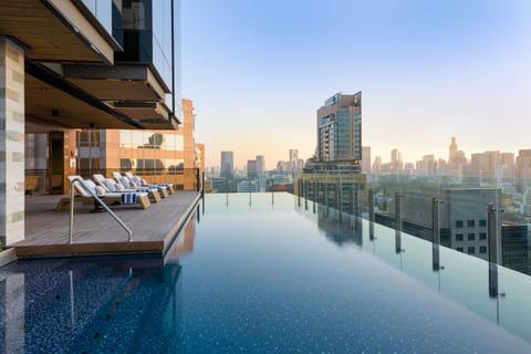 Outdoor pool, open 7:00 AM to 9:00 PM, pool umbrellas, sun loungers