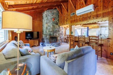 Living room with wood burning fireplace.