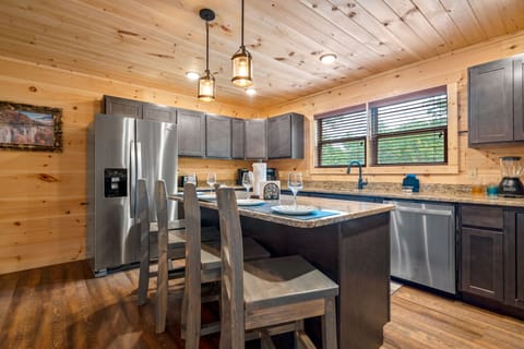 Fully equipped kitchen with extra seating.