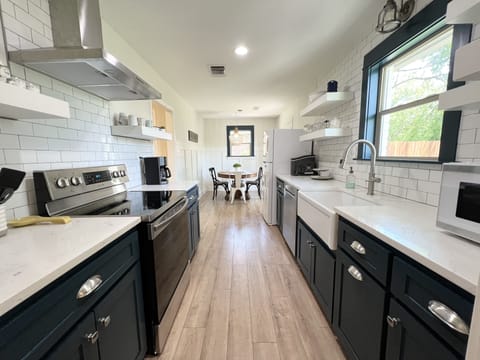 Fresh, clean & fully stocked kitchen.  Light & bright