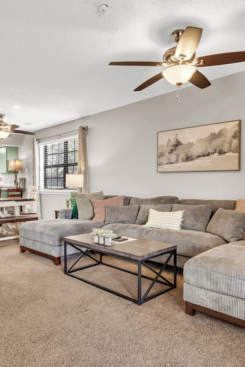 Living room - light and bright with tons of space and comfortable seating. 