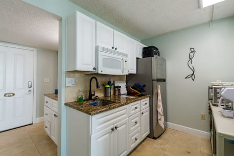 Full size refrigerator and hot plate.