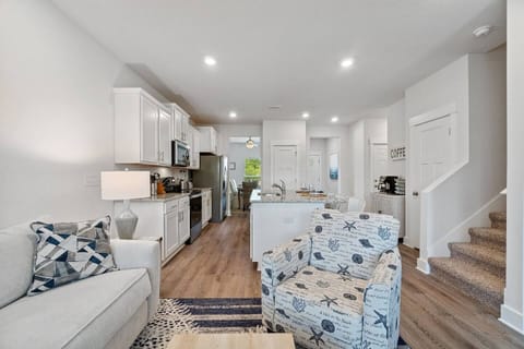 Open floor plan downstairs provides ample space for cooking/living/dining. Flooring is all EVP on first floor, for sandy beach simplicity.