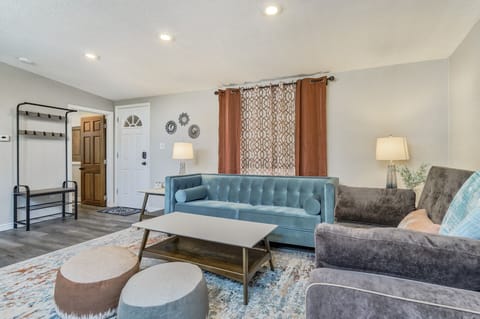 Stylish living room with a couch that converts to a full sized bed!