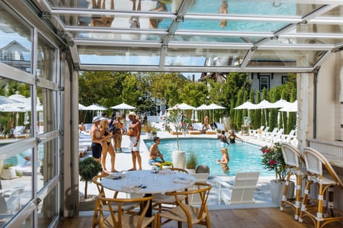 Seasonal outdoor pool, open 10:00 AM to 5:00 PM, pool umbrellas