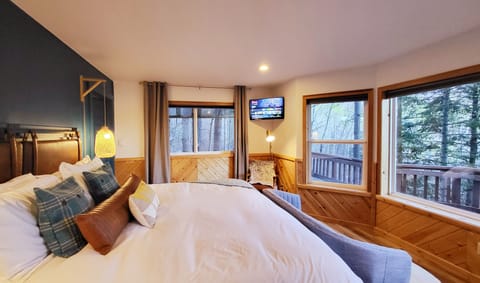 Master bedroom with king bed, TV and excellent mountain and lake views