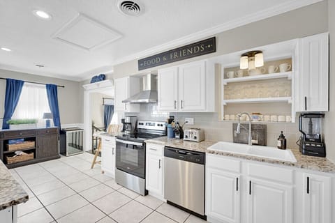 Kitchen with granite counter tops and stainless steel appliances.