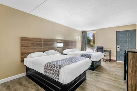 Down comforters, desk, blackout drapes, iron/ironing board