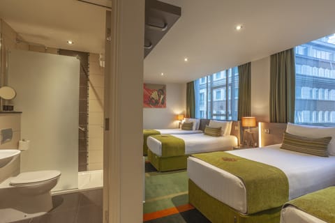 Classic Quadruple Room | Minibar, in-room safe, desk, blackout drapes