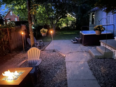 Hot tub with firepit and chairs